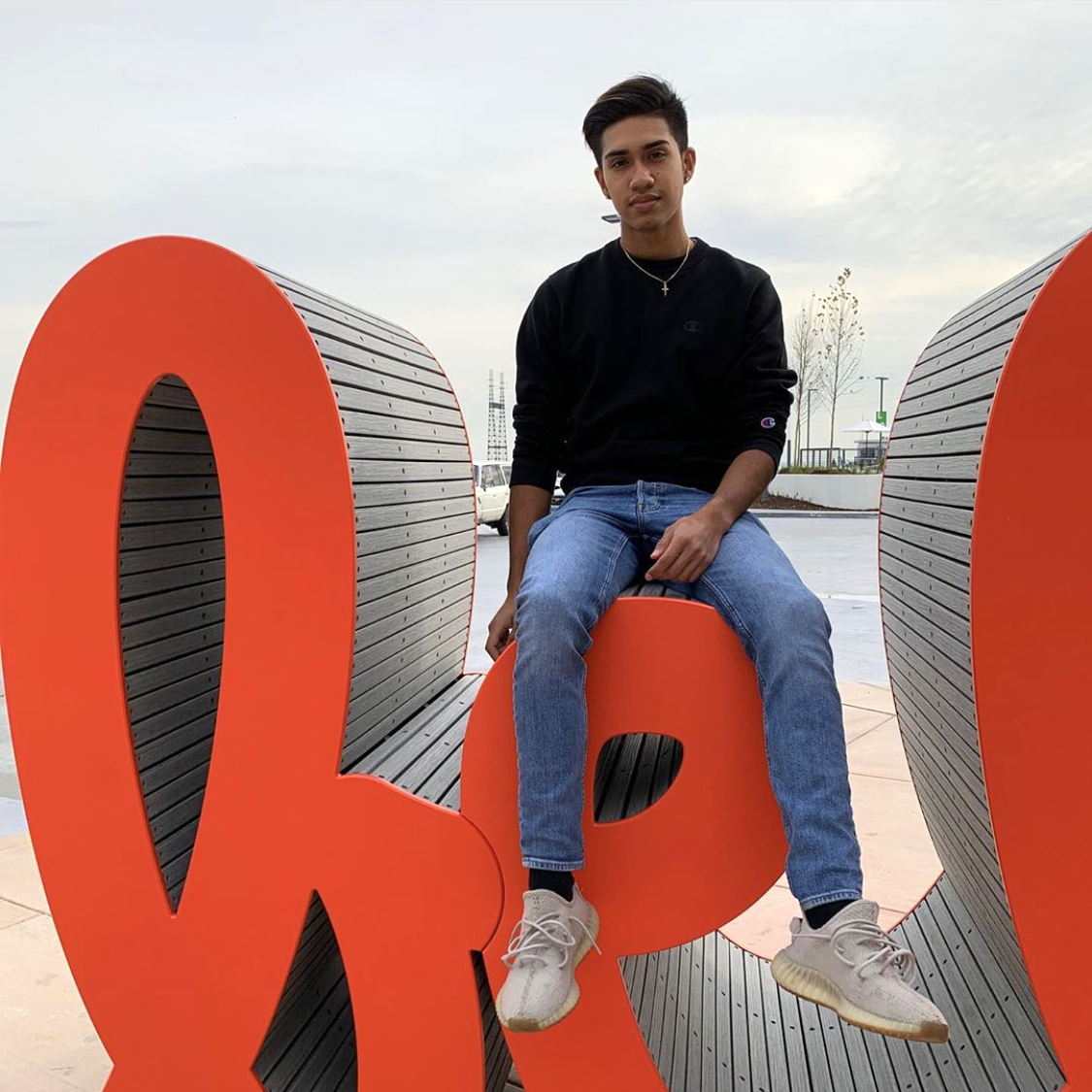 Posing with Matthew Hoffman’s “Be bold” public art sculpture in St. Charles, a joyful landmark celebrating self-expression.