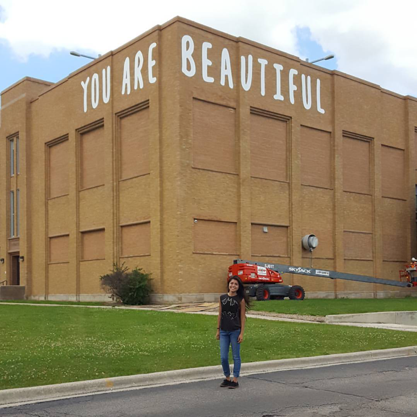 Matthew Hoffman You Are Beautiful Chicago school facade visible from highway public art