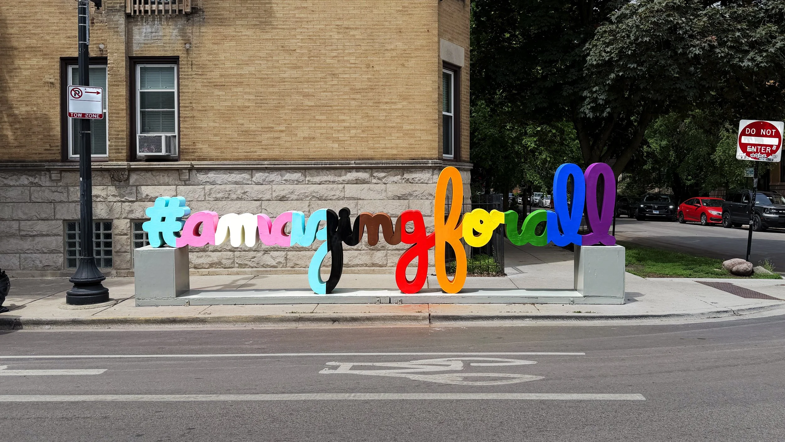 Colorful #AmazingForAll public art sculpture by Matthew Hoffman installed in Chicago’s Northalsted neighborhood.