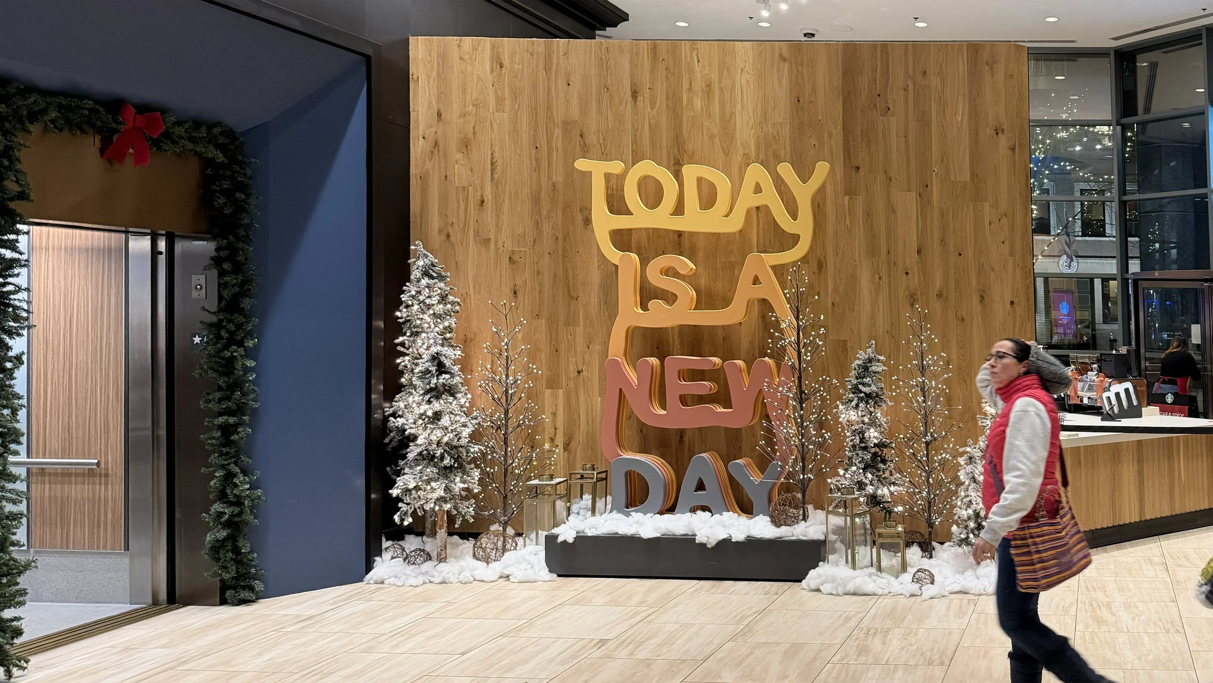 Large-scale "Today Is A New Day" sculpture by Matthew Hoffman installed across two floors of the Hyatt Centric Chicago Magnificent Mile lobby.