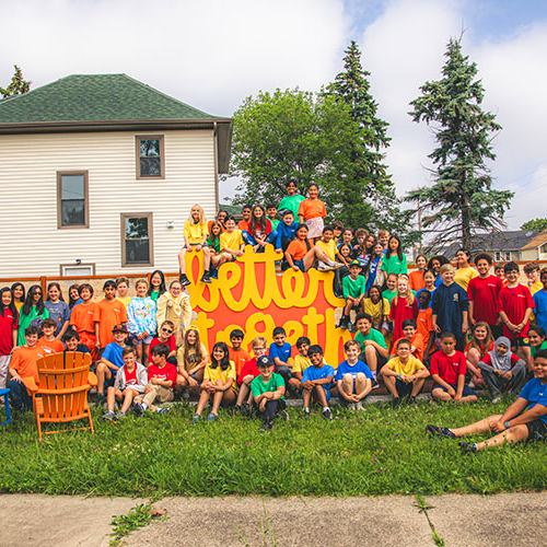 Community members interacting with Matthew Hoffman’s sculpture, an uplifting example of placemaking and the power of public art.