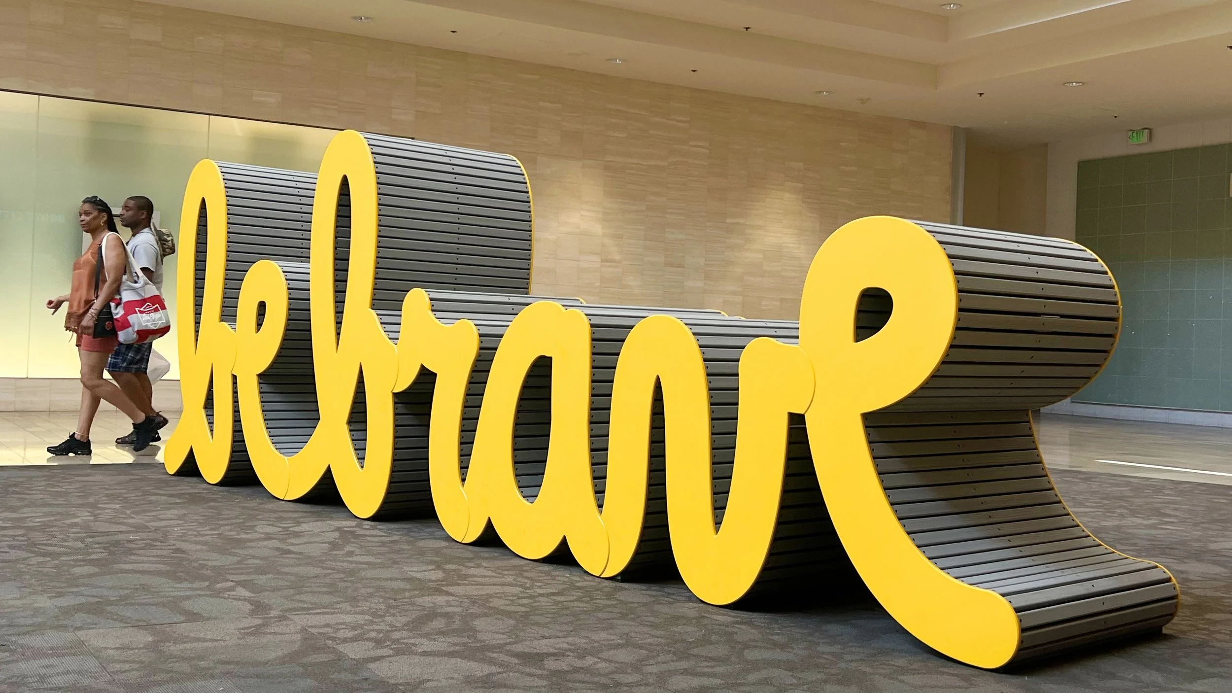 Large yellow Be Brave sculpture by Matthew Hoffman installed at Fashion Show Mall in Las Vegas, Nevada.
