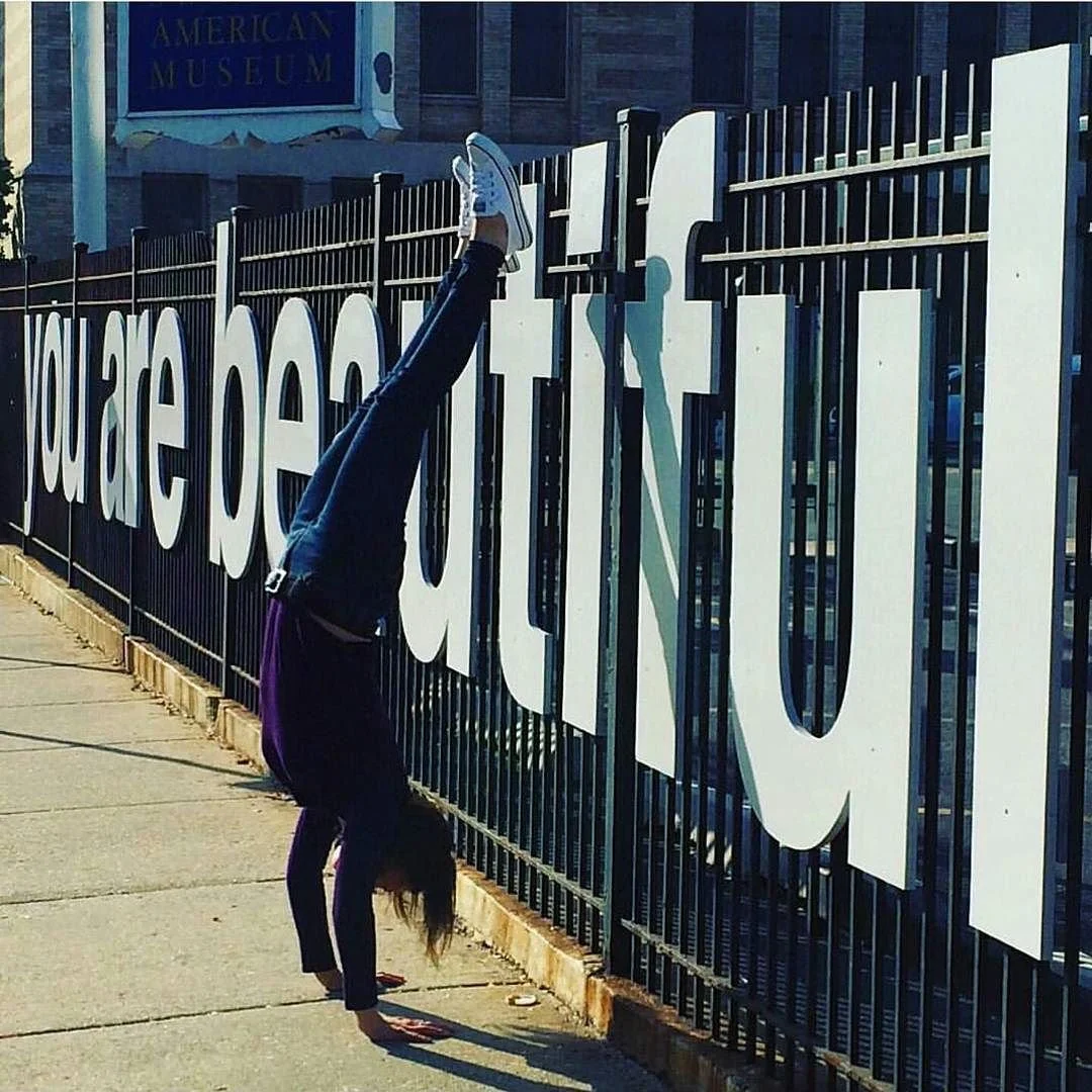 Close-up of the you are beautiful fence piece in andersonville chicago