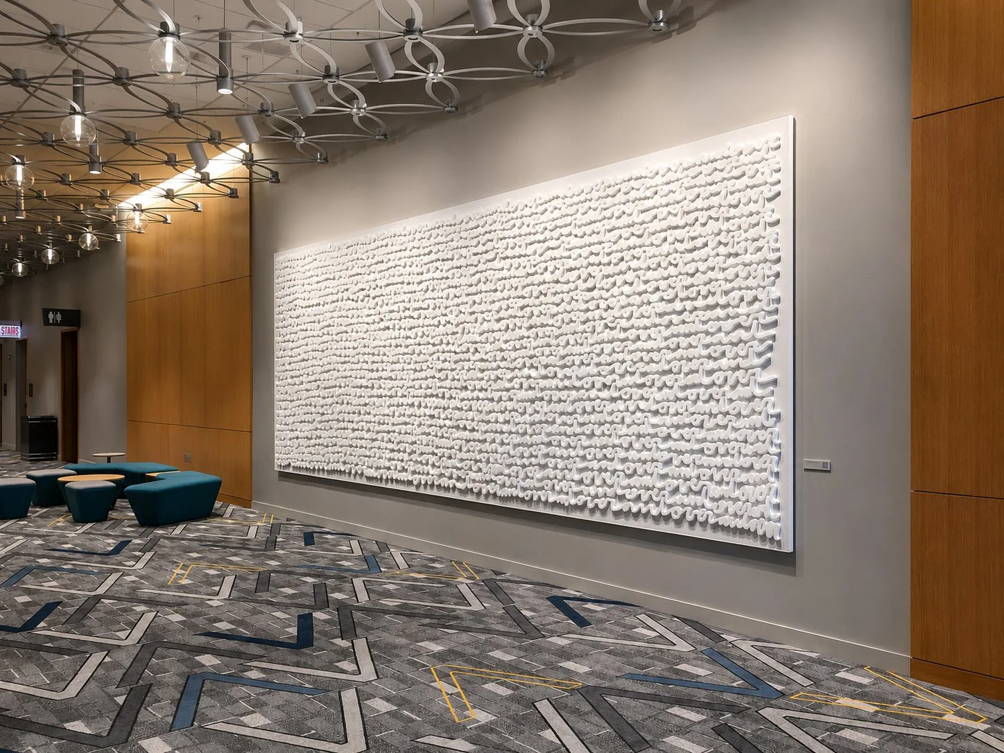 Interior hospitality artwork at Marriott Marquis Chicago featuring a large-scale dimensional handwritten text installation by Matthew Hoffman
