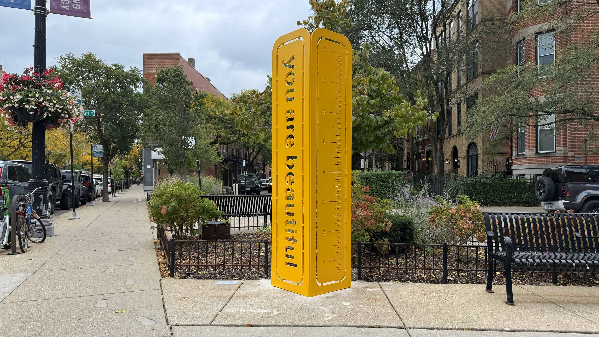 Matthew Hoffman’s Positivity Rules with the “you are beautiful” face visible in Dad’s Park.