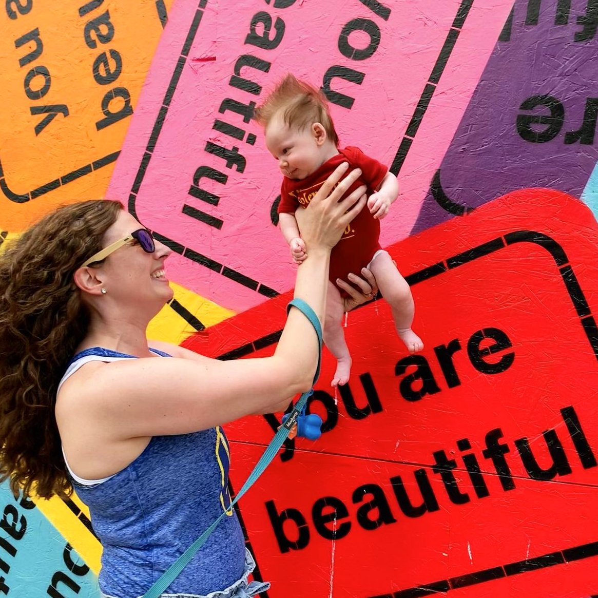 You Are Beautiful collage mural covering a temporary construction wall in downtown Milwaukee, Wisconsin.