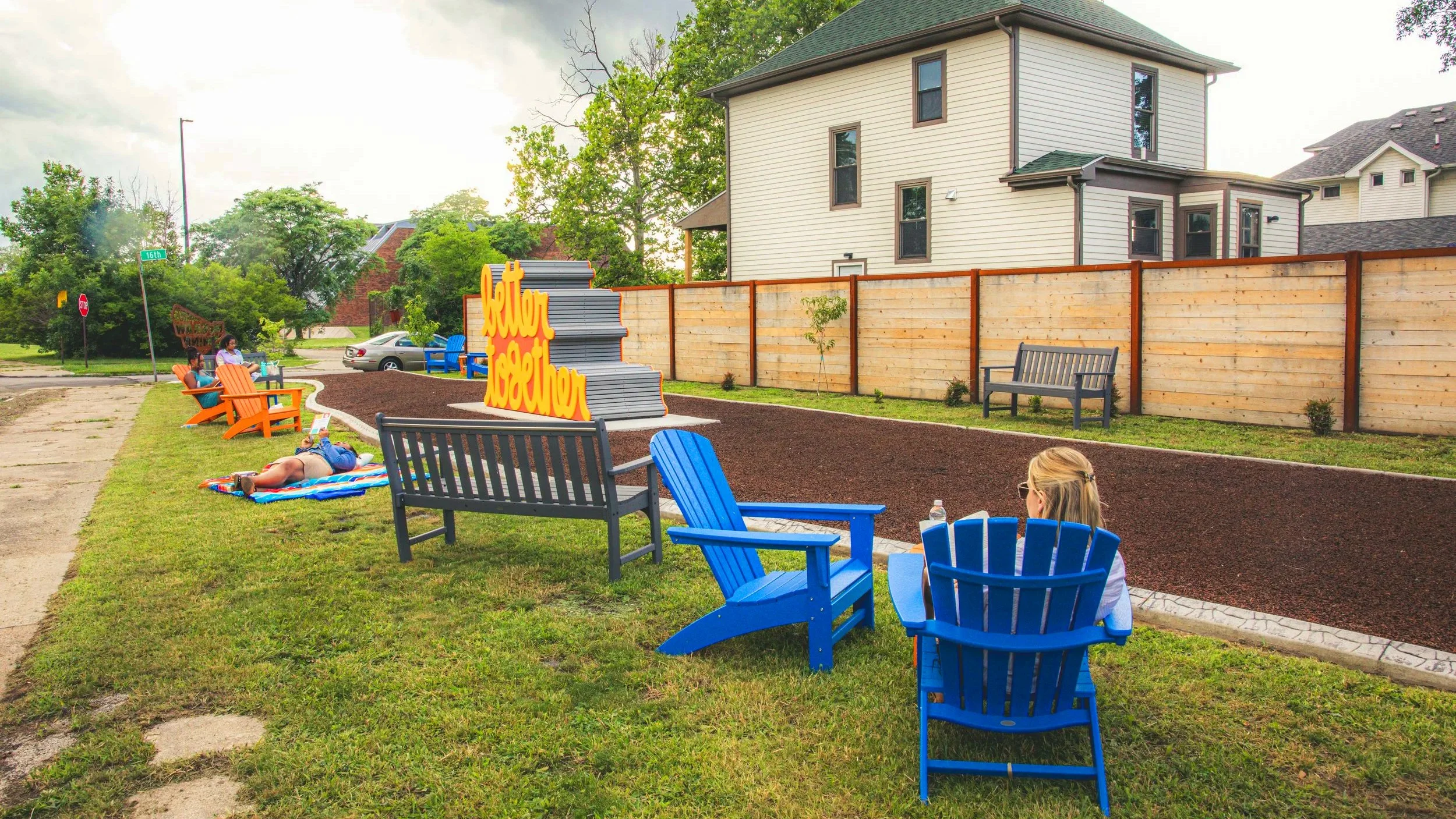 Community members interacting with Matthew Hoffman’s sculpture, an uplifting example of placemaking and the power of public art.