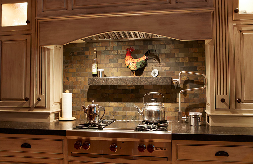   Even this backsplash is finished with warm earthen tile in this celebration of the natural.     