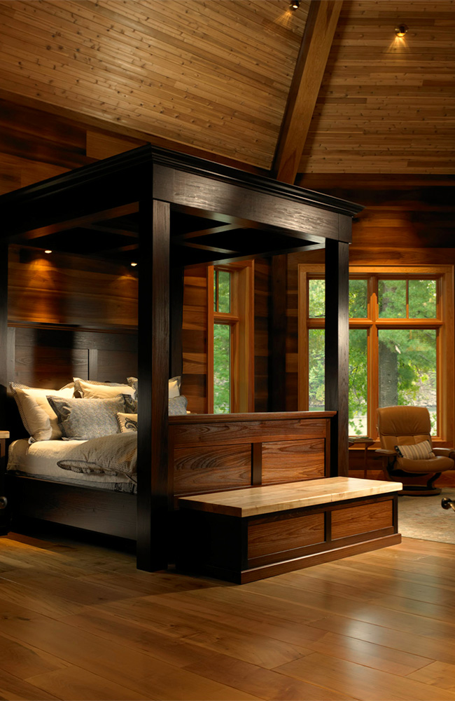   The octagonal master bedroom with a circumference of true-divided lite windows is a magnificent treetop retreat.     
