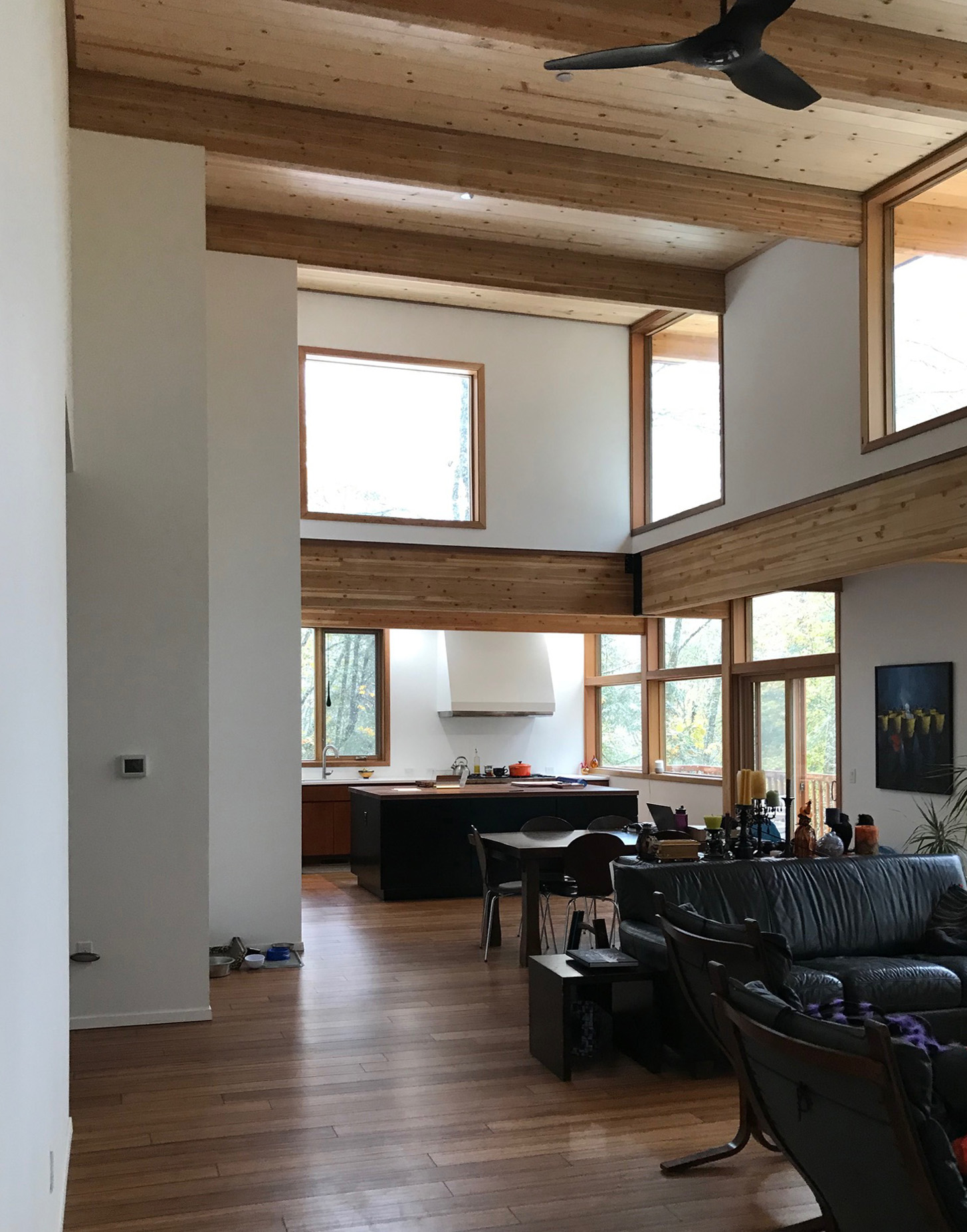 One great room. As the space and their functions go from more to less communal, this great room gets progressively narrower.