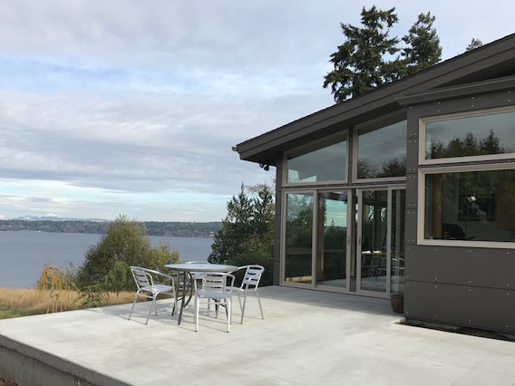 ...Instead a large terrace on the side of the house has a view of its own and can be accessed from the dining room, kitchen, and front entry