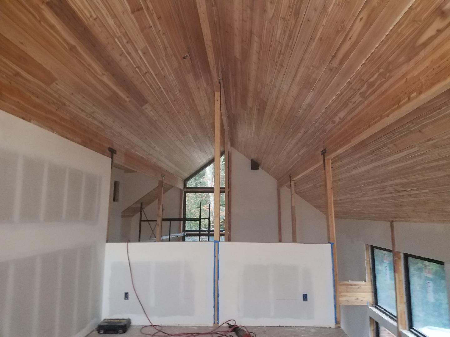 Beautifully finished Lindal tongue and groove cedar lines the roof, and radiates warmth,  Shown here from the master bedroom