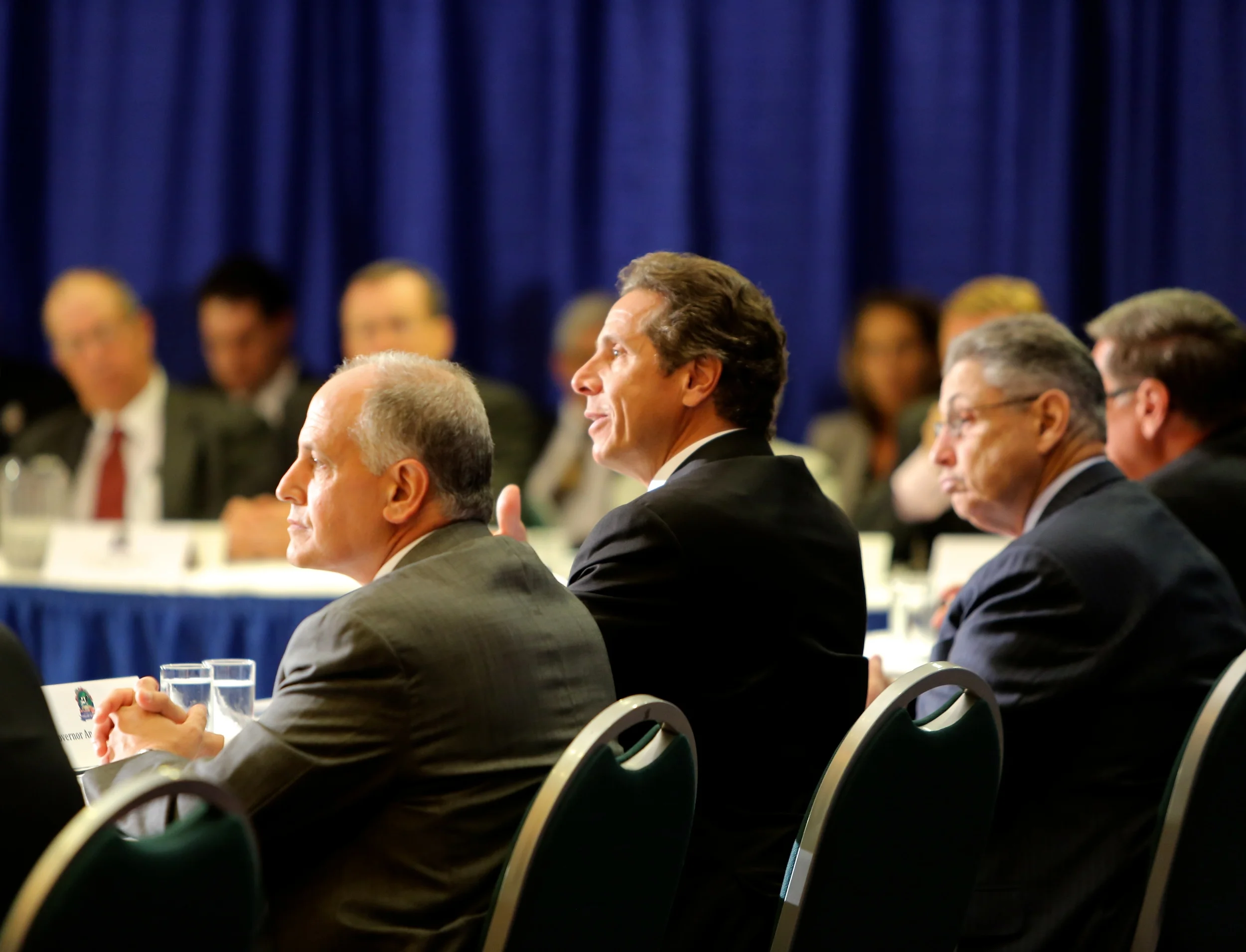 Larry Schwartz , left, had an active role in the troublesome review process of the AEG racino bid, as did State Assembly Speaker Sheldon Silver , (D-Manhattan) right. Above, Mr. Schwartz and Speaker Silver joined Gov. Andrew Cuomo (D-NY) at a 2012 yogurt summit. Source : Official Photograph (New York Governor's Office)