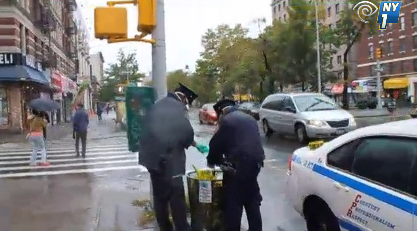 Officers from the New York Police Department discarded medical masks and latex gloves, which the police officers had used to secure Dr. Craig Spencer's apartment, into a corner garbage can on a public sidewalk - a blatant disregard for the safe disposal of hazardous medical waste. Source : NY1 The Call
