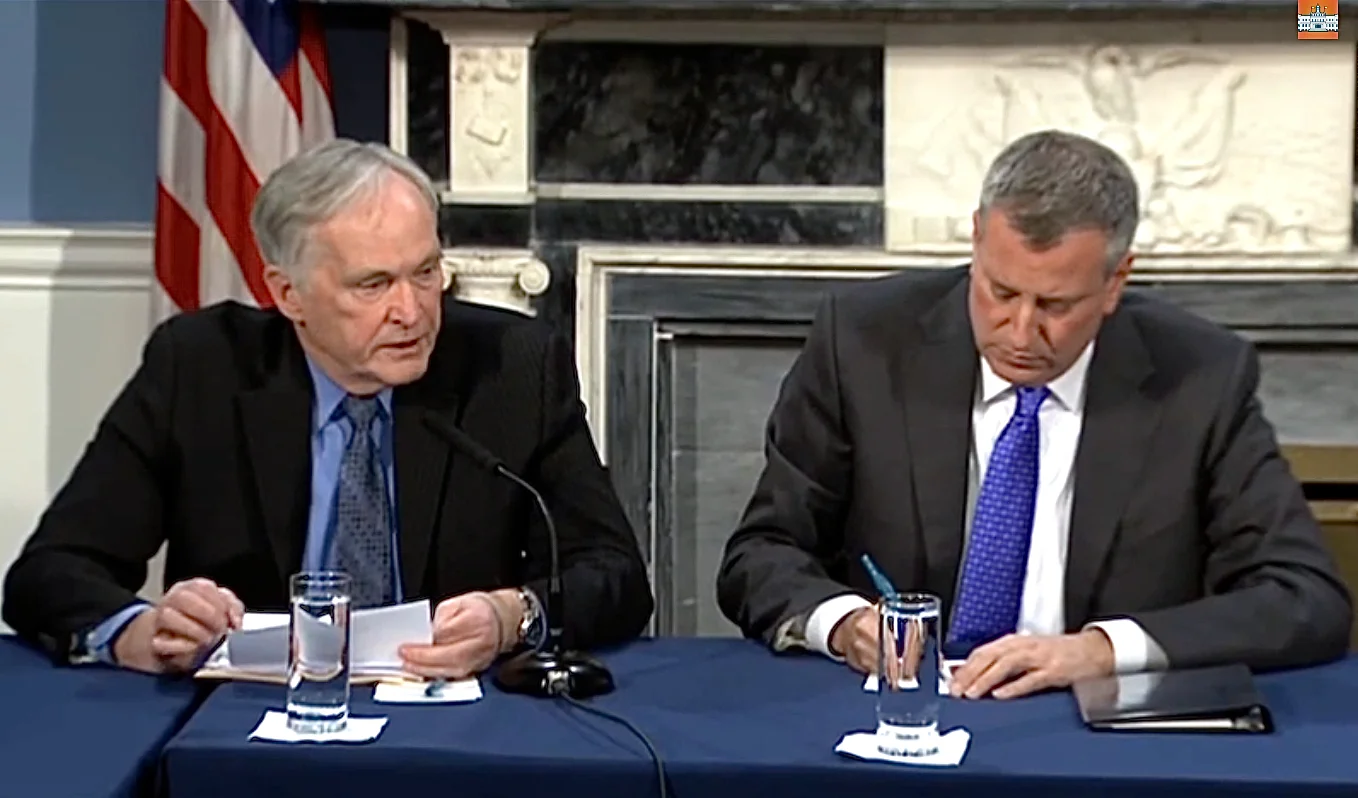 New York City Department of Corrections Commissioner Joseph Ponte , left, reads from his statement at a media roundtable Thursday with Mayor Bill de Blasio at his side. Source : NYC Mayor's Office/YouTube Screen Shot