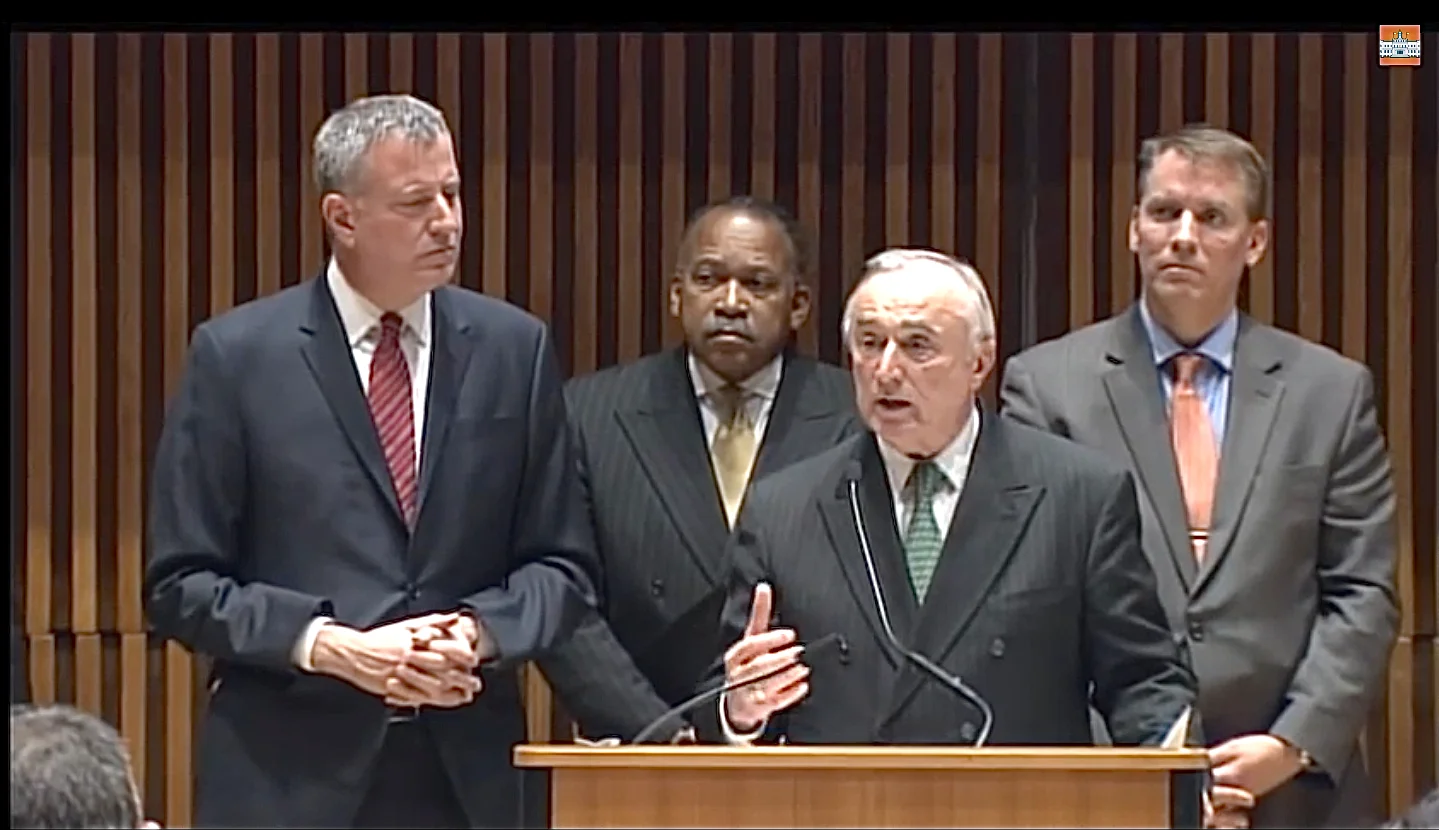 At a press conference Monday at One Police Plaza with Mayor Bill de Blasio at his side, NYPD Commissioner William Bratton said that, " Broken Windows is here to stay. Stop, question, and frisk is here to stay." Source : NYC Mayor's Office/YouTube Screen Shot