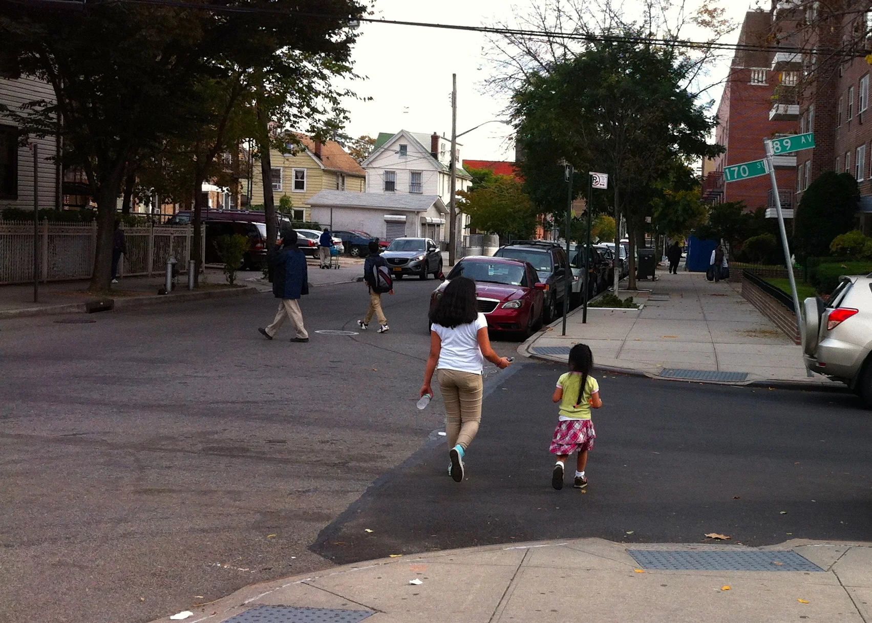 Children crossing an intersection at 170th Street and 89th Avenue in Jamaica, Queens on October 28, 2014. Some residents fear the heavy, commercial trucks barreling down 170th Street pose a potential hazard to pedestrian safety. Source : Louis Flores
