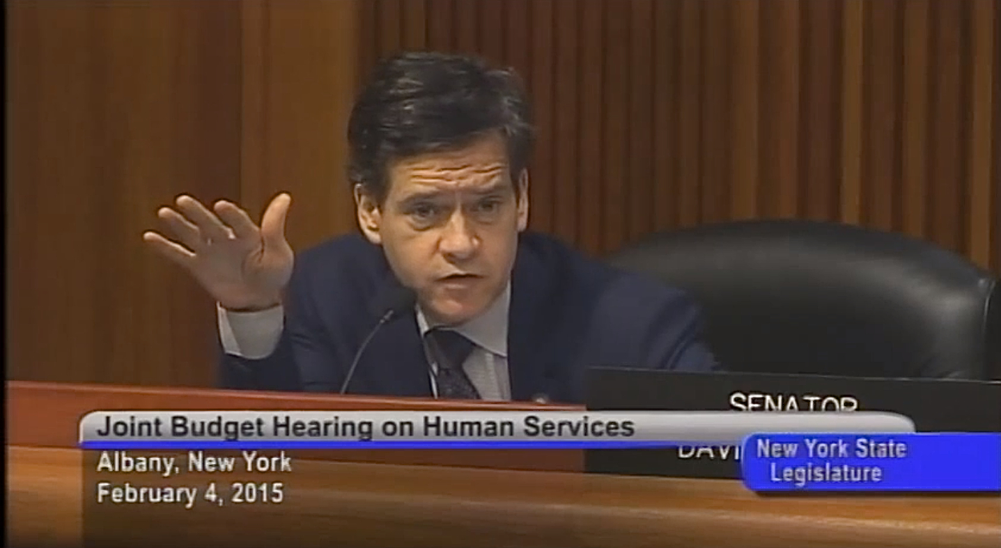 State Senator Brad Hoylman at a February 4, 2015, joint hearing. State Senator Hoylman has proposed ethics reforms that some government reform activists wish could have been in force and effect years ago, when State Senator Hoylman, before his election to the state legislature, oversaw the zone-busting application of the $1 billion luxury condo conversion of St. Vincent's Hospital. Source : New York State Senate/YouTube