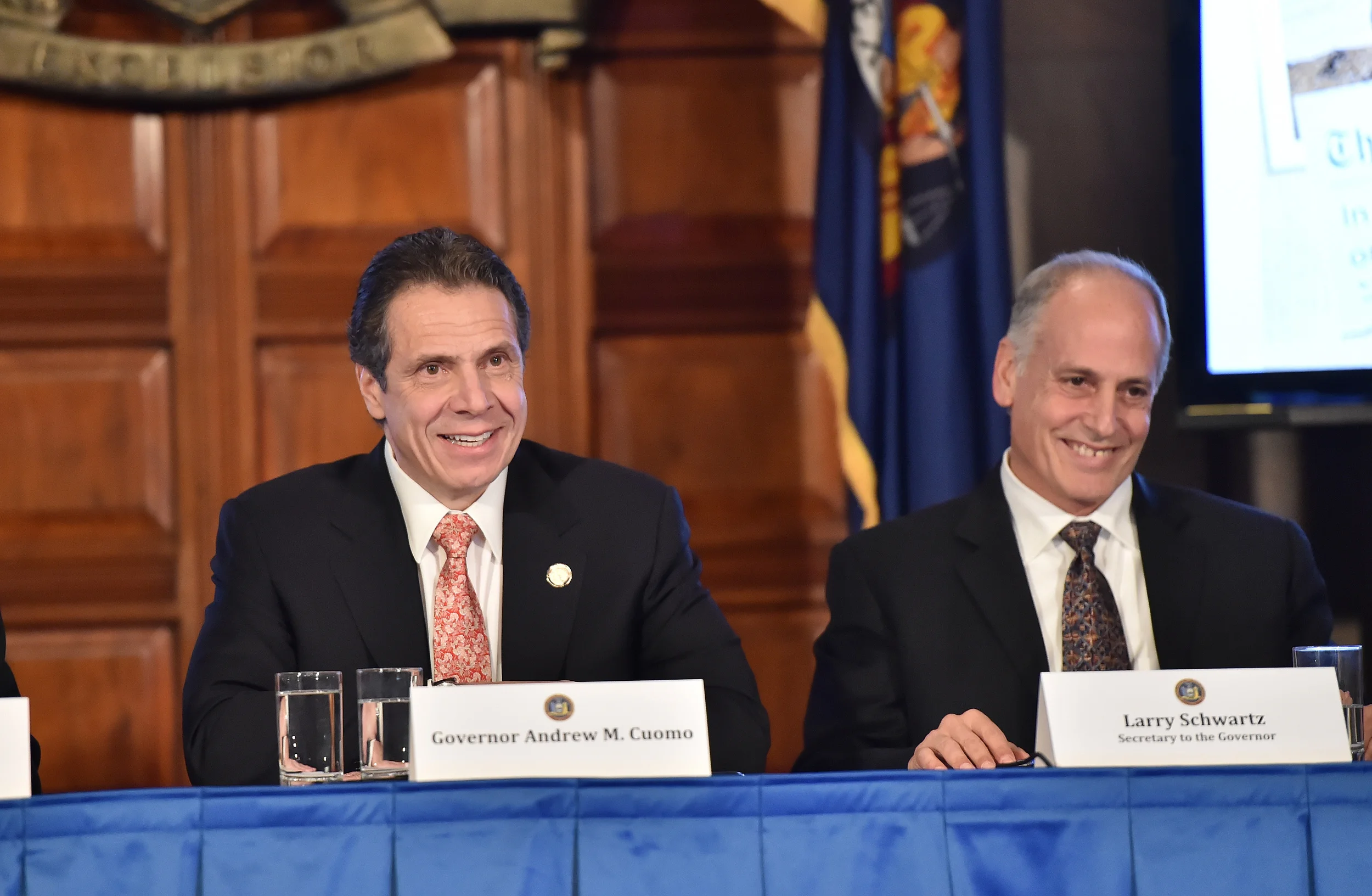 Lawrence Schwartz , right, with Governor Andrew Cuomo at a cabinet meeting in 2014. Mr. Schwartz was given a controversial, temporary job after he publicly stepped down as the governor's secretary. Source : Official Photograph/Kevin P. Coughlin/Office of the Governor/Flickr