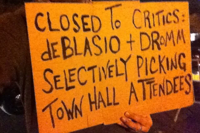 A protest sign carried by the publisher of Progress Queens outside P.S. 69, the site of Mayor Bill de Blasio's town hall. Source : Louis Flores/Progress Queens