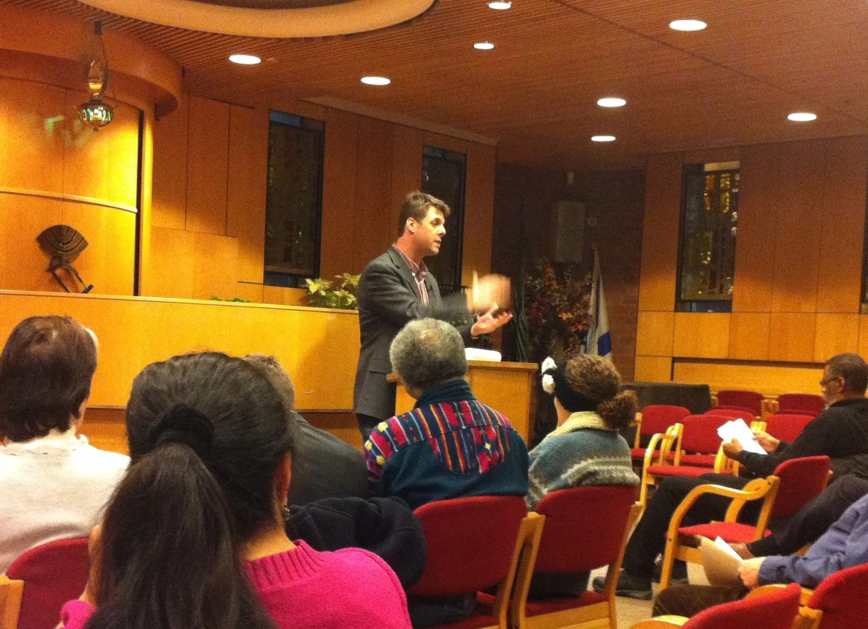 Peter Sikora , a community organiser from Brooklyn and a research economist with the Communications Workers of America , District 1, spoke at the Jewish Community Center in Jackson Heights on Thursday evening. Source : Louis Flores/Progress Queens
