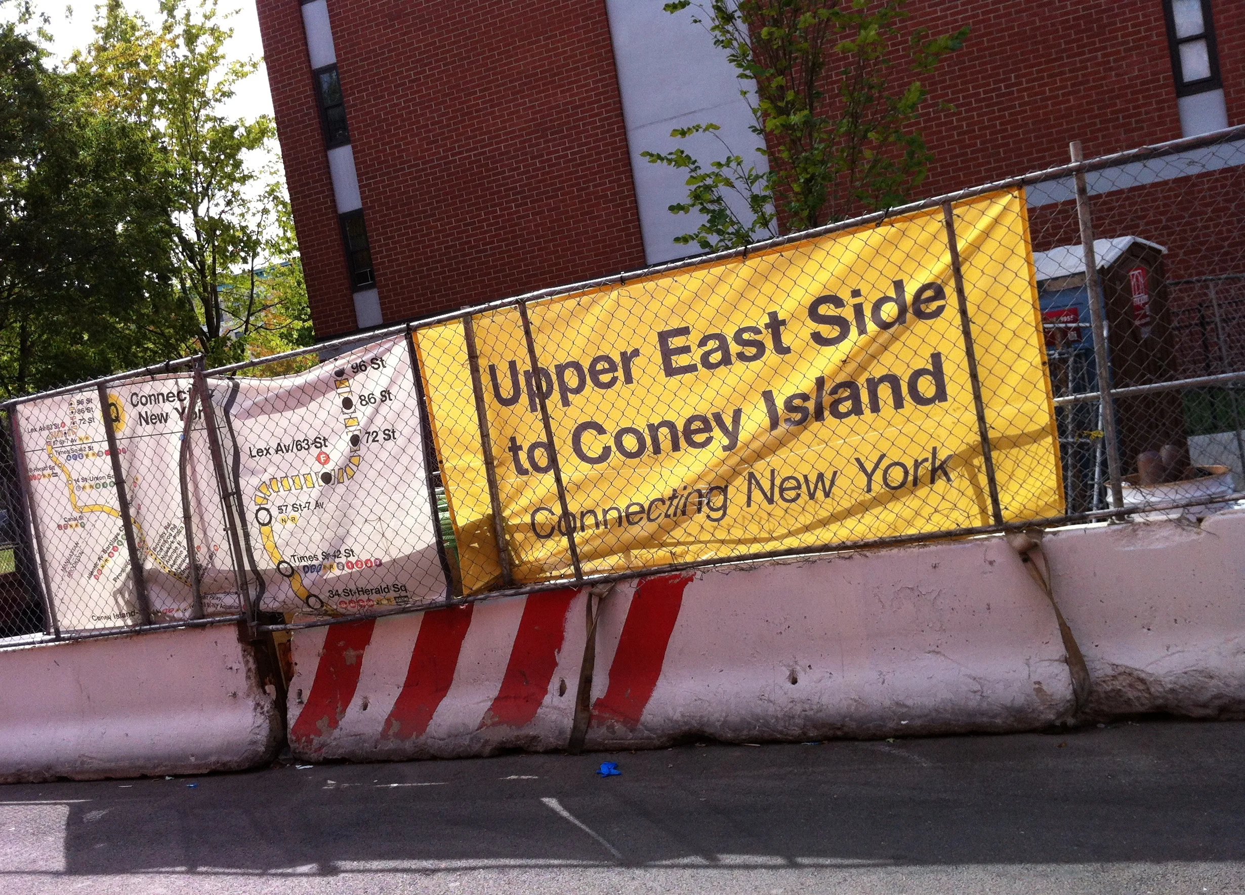 A staging area for materials used in the construction of the Second Avenue Subway was set up alongside East 101st Street near the southeast corner of Second Avenue. Metro Plaza North, a NYCHA public housing development where a water sample tested positive for lead at 1,249 ppb, was located one block from this staging area. Source : Louis Flores/Progress Queens