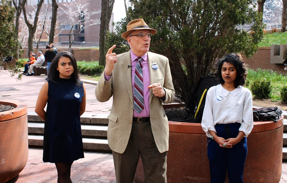 Robert Gangi , center, during a press conference in front of One Police Plaza in Downtown Manhattan. Mr. Gangi announced his campaign to run for the Democratic Party primary in the 2017 New York City's mayor's race. With him were his two campaign coördinators : Alicia Bella , left, and Maesha Meto , right. Source : Louis Flores/Progress Queens