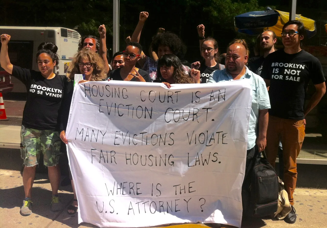 Tenant activists demonstrated on Friday morning outside of Brooklyn Housing Court , following the adjournment of the eviction action against Brooklyn tenant organiser Rebecca Stuart. Ms. Stuart alleged that her landlord was retaliating and discriminating against her and her roommate. Source : Louis Flores/Progress Queens