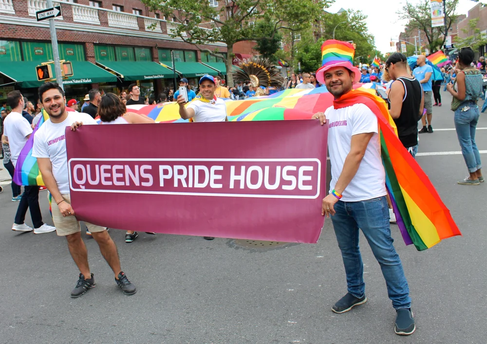 Representatives of the Queens Pride House awaited the start of the Queens Pride Parade in Jackson Heights, Queens, on Sunday afternoon. The Queens Pride House is a cornerstone center for the LGBT community in Queens. Originally founded in January 1997, the Queens Pride House has, over the years, provided critical social, health, and community services to LGBT Queens residents. However, cuts to the Queens Pride House's budget, noted in a 2010 report published by The New York Times , were not cured by openly gay New York City Councilmembers Daniel Dromm (D-Jackson Heights) or Jimmy Van Bramer (D-Sunnyside), according to that report. Source : Louis Flores/Progress Queens
