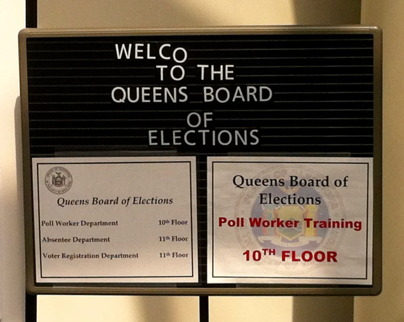 The welcome sign outside the ground floor offices of the Queens Borough Office of the New York City Board of Elections on Queens Boulevard. Source : Louis Flores/Progress Queens