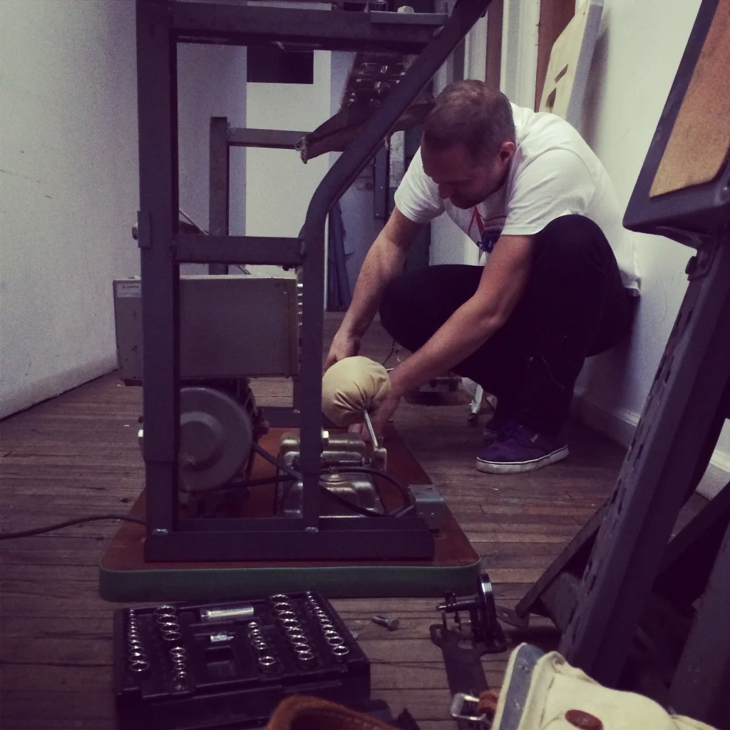 Pete mid-sewing machine rebuild. Brooklyn NY, 2014