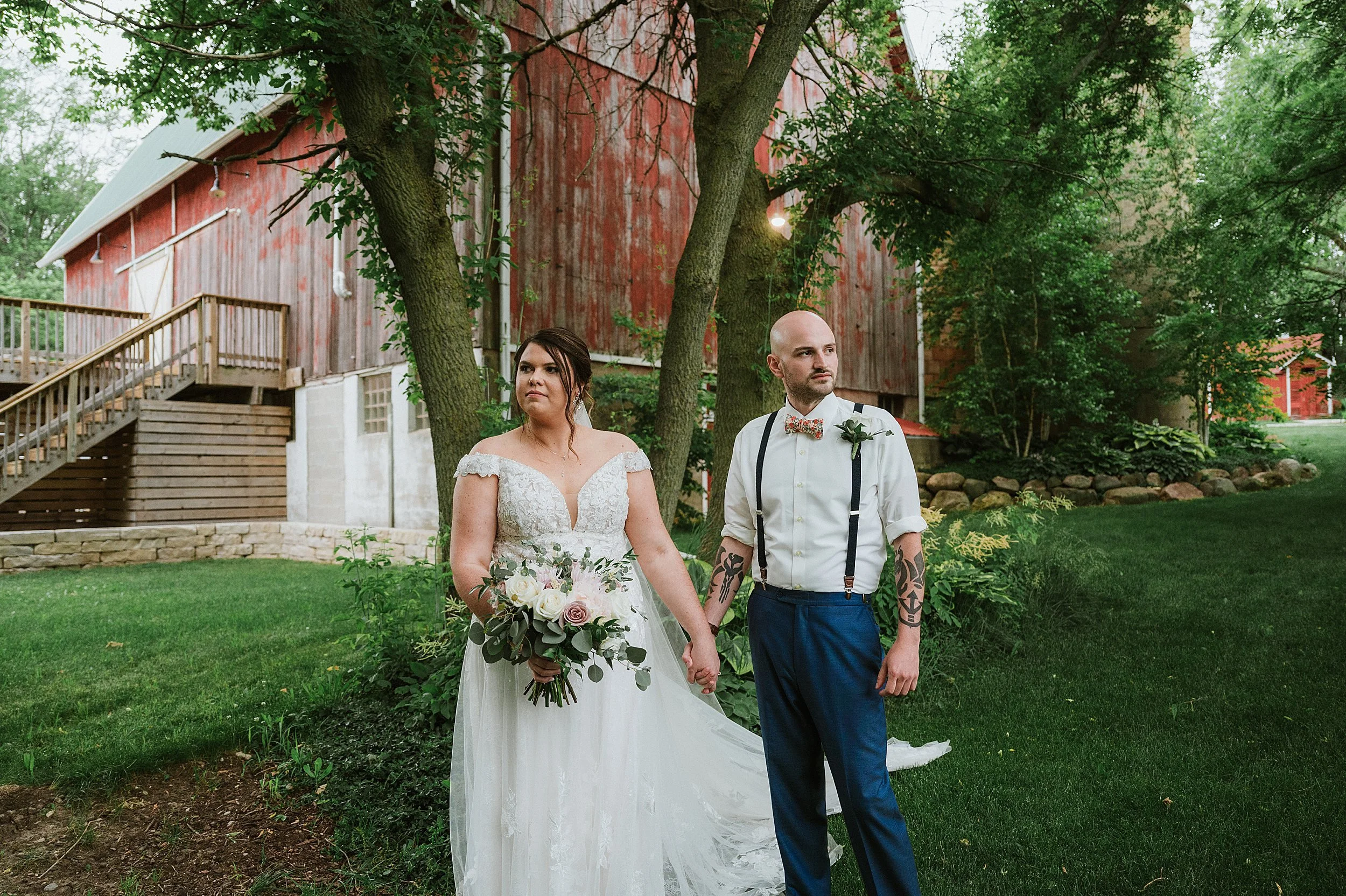 RoostMKE Married in Milwaukee Mapleton Barn Wedding Outdoor Wisconsin bride and groom lightsaber duel_0074.jpg