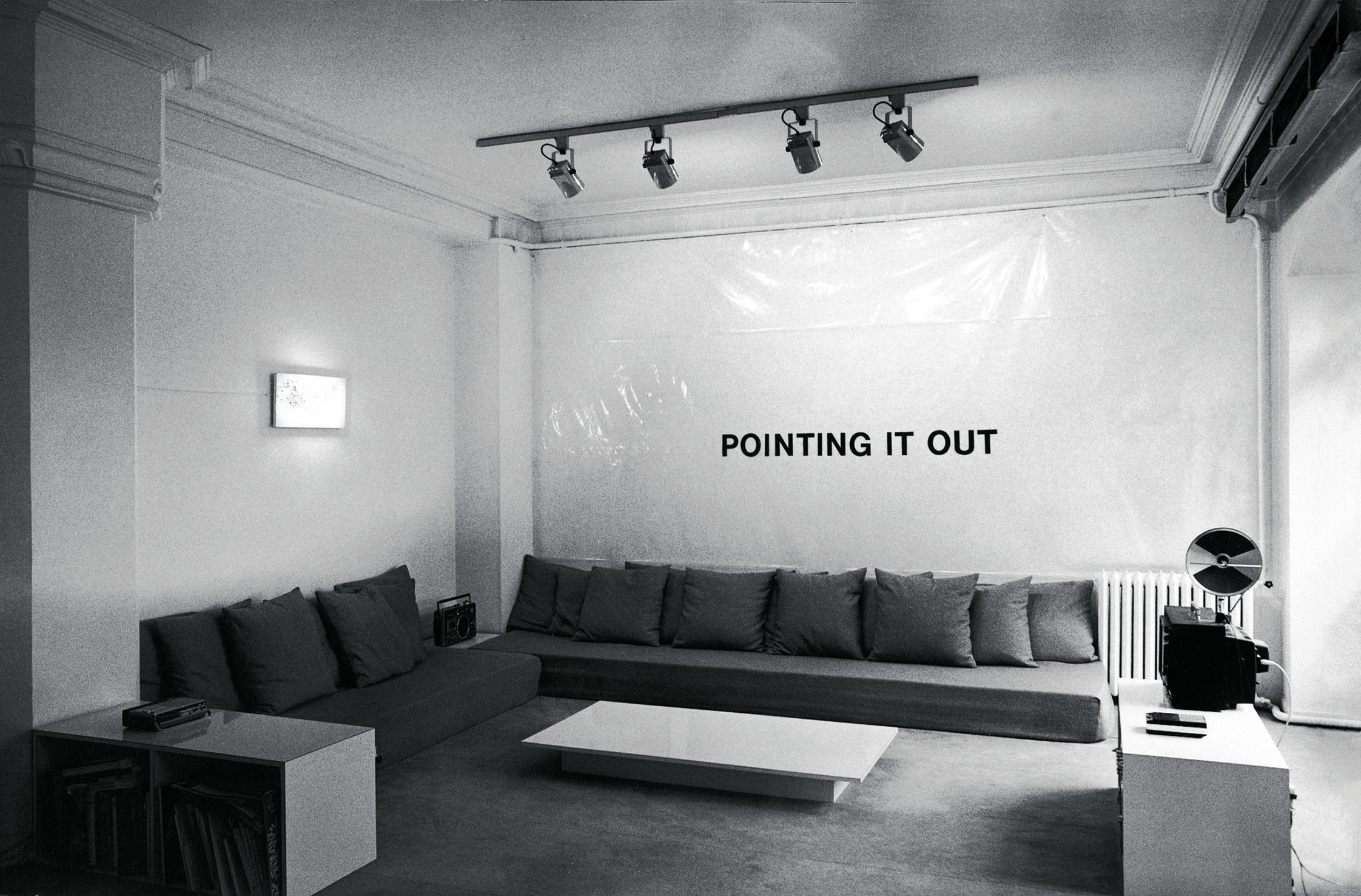 POINT IT OUT (1976-1977) ADHESIVE VINYL LETTERS, SITE SPECIFIC