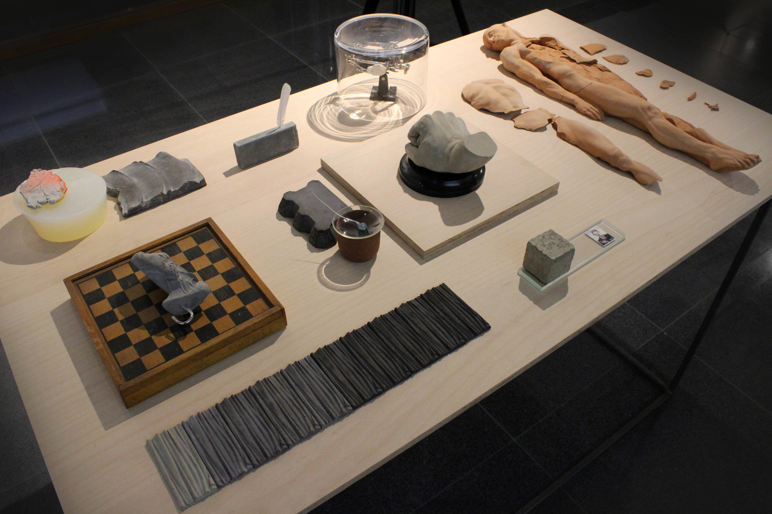 WORKING TABLE (2013) terracotta, glass, concrete, photography, wood, paint, resin, feather, variable dimensions