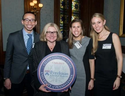 Penn Medicine Trustee and 250th Celebration Co-Chair Rosemary Mazanet, GR’81, M’86, PAR’11, flanked by current students, left to right, Wes Phillips, M’15, Yael Nobel, M’15, and Maren Shapiro, M’16, at the Penn Club for Penn Medicine’s regional event in New York City.