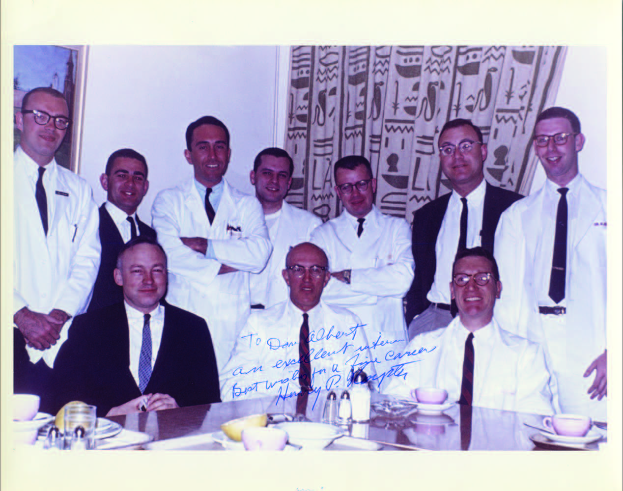   Dan Albert (far right), as a student in 1960 on the Plastics Service with Chief, Dr. Henry P. Royster, M’35, RES’42 (center front).  