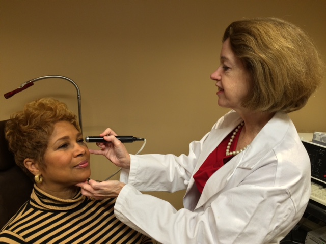 Dr. O’Brien examining a patient.