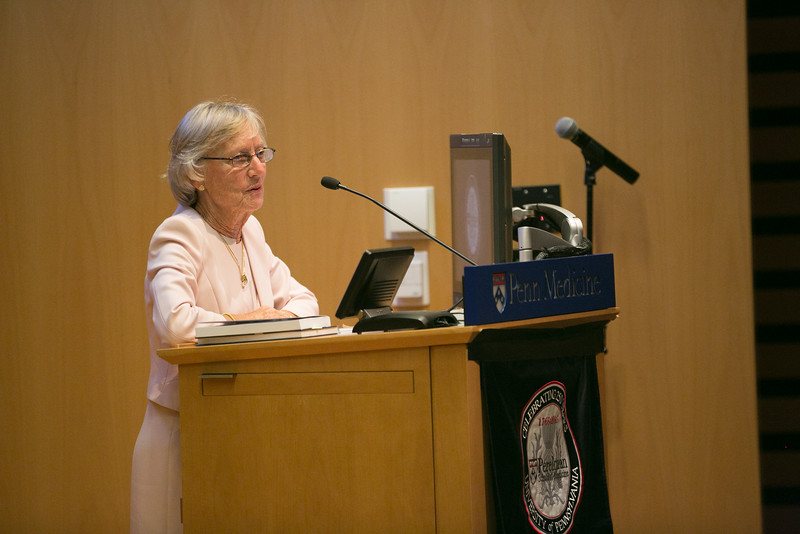   Barrie Jordan accepting the Lifetime Achievement Award for her late husband Henry A. Jordan, M’62, RES’67  
