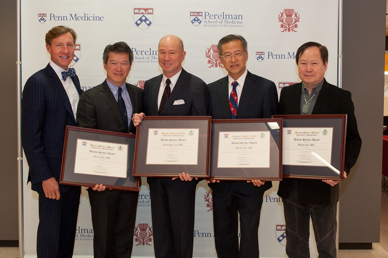 Alumni Service Award winners: Jeremy Law, M’86, Christopher Law, C’78, M’82, Ronald Law, C’71, M’75, and Dennis Law, C’69, M’73 