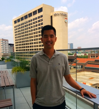 Jason on the Jordan Center roof in front of Penn Tower.