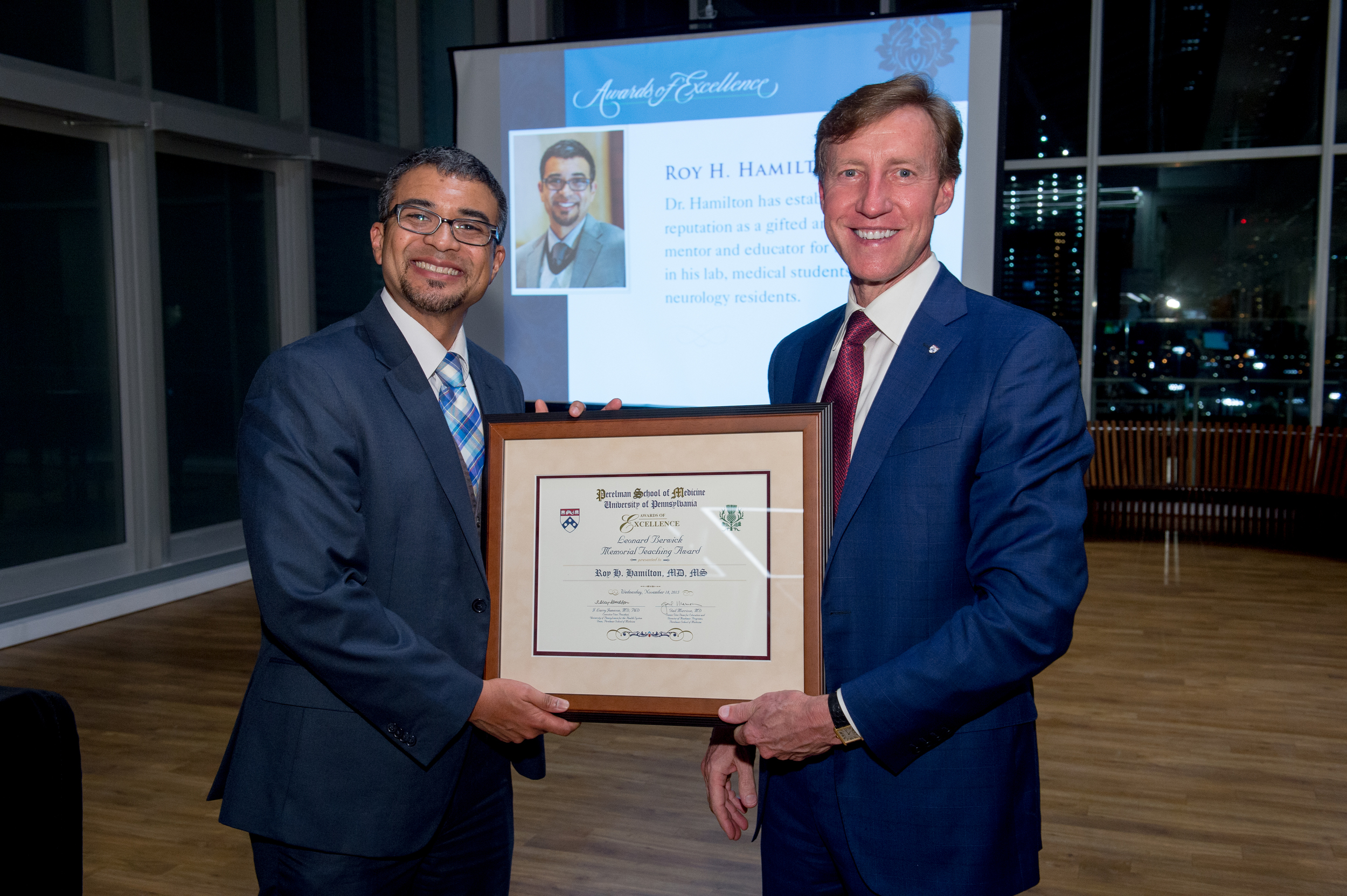   Dr. Hamilton accepts his award from Dean Jameson  