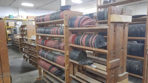 These discs are silicon molds used to make the pewter figures. Iron Wind Metals has been around since the 70s, so they have a ridiculous amount of these molds.