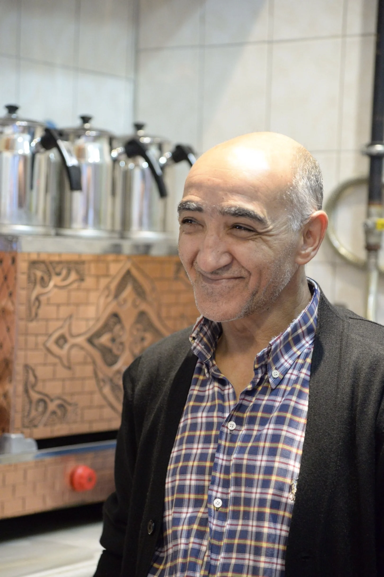 Coffee and tea seller in his tiny kiosk 