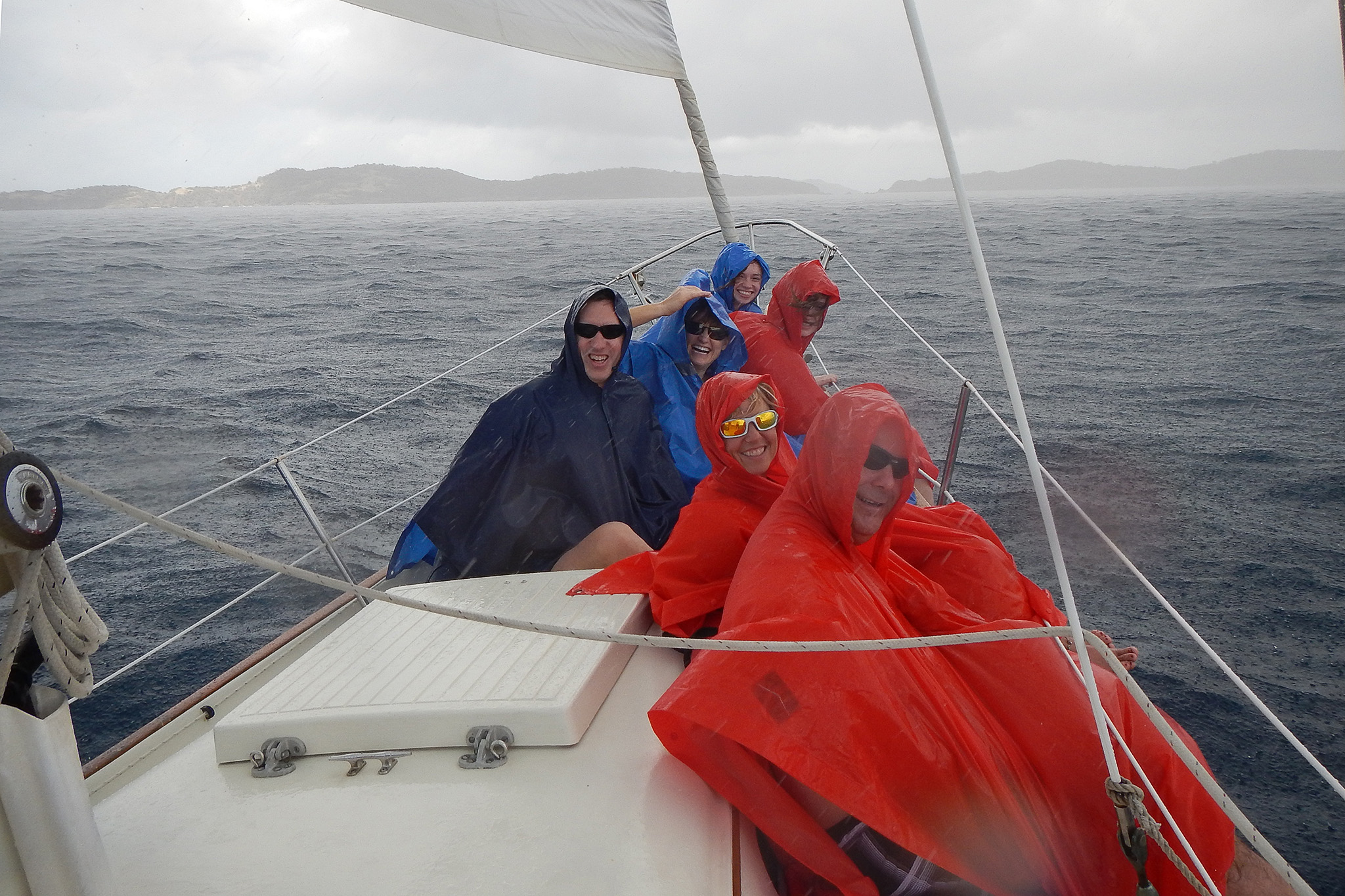 Bonding on Calabaza in St Thomas during a squall with new friends we met "online" and shared a sailboat charter with. (I promise the sun was out for most of it!)