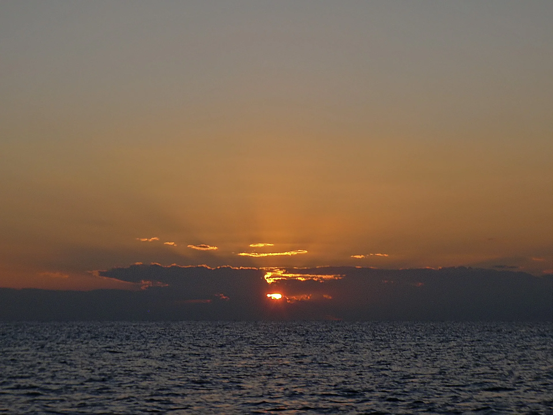Sunset from the Grandeur of the Seas; wondering about that distant Island!