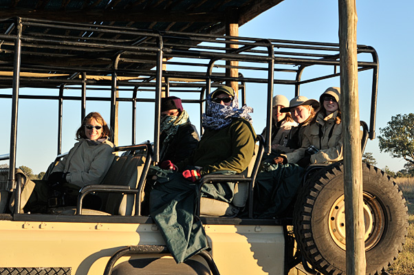 My sister and brother in law use their scarfs to keep them warm on the Rover and to keep the tiny flying midges off during a wild boat ride through the channels of the Okavango Delta in Botswana