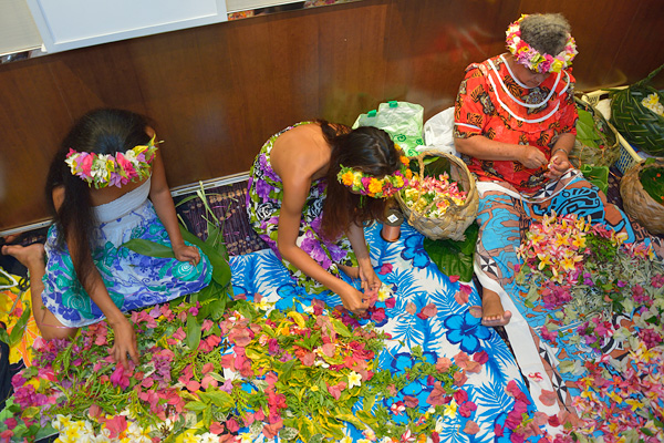 In the area alongside L'Etoile dining room, local women make leis, and heis with guests on Polynesian night