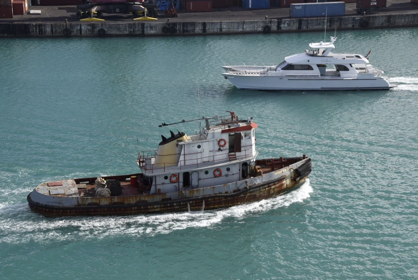 A tug and a motor yacht