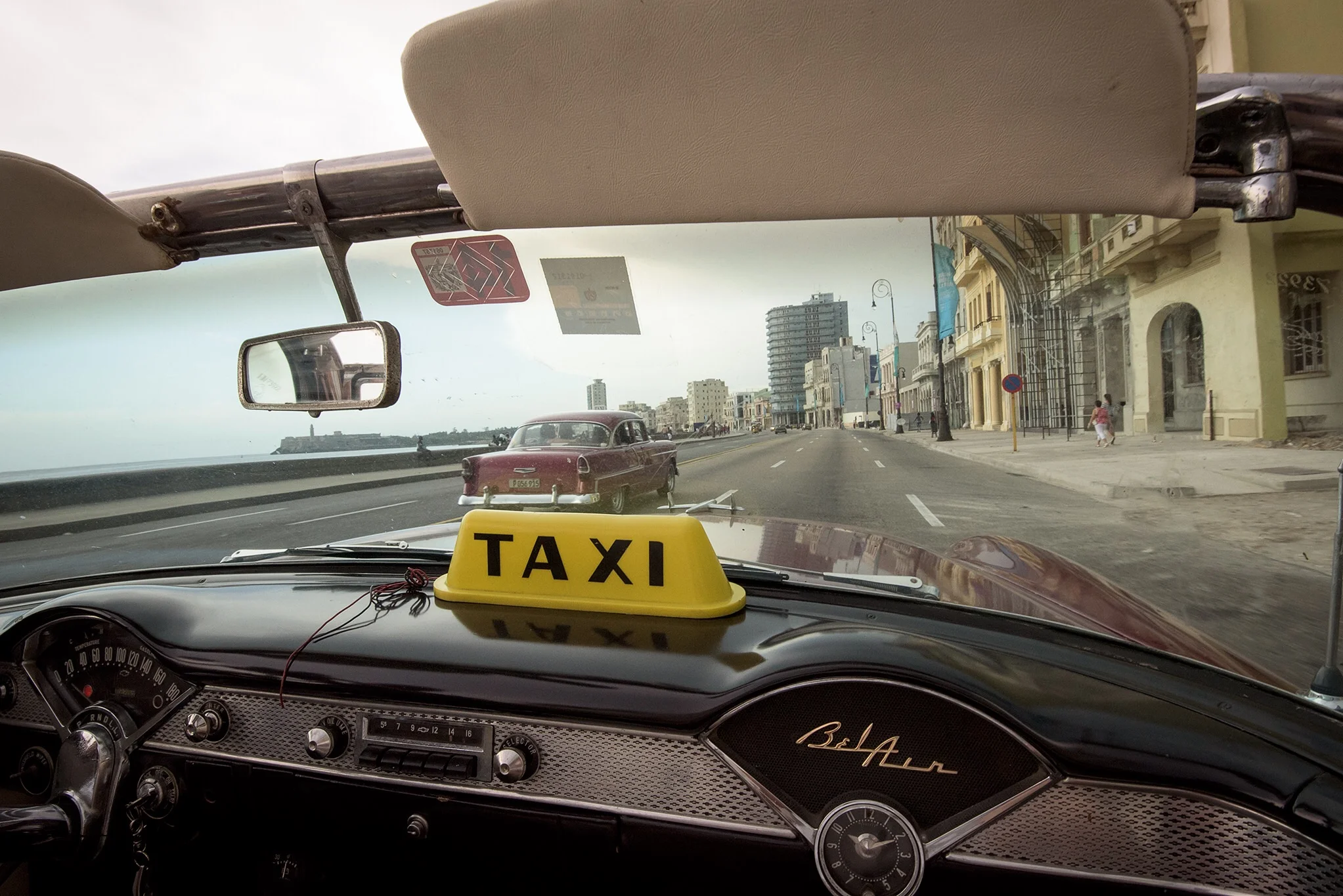 Cruising along Havana's Malecon in a vintage American car is "bucket list" experience for most Americans. It's unlikely the Cuban government or private taxi owners will sell cars like these that they use as tourist taxis. 