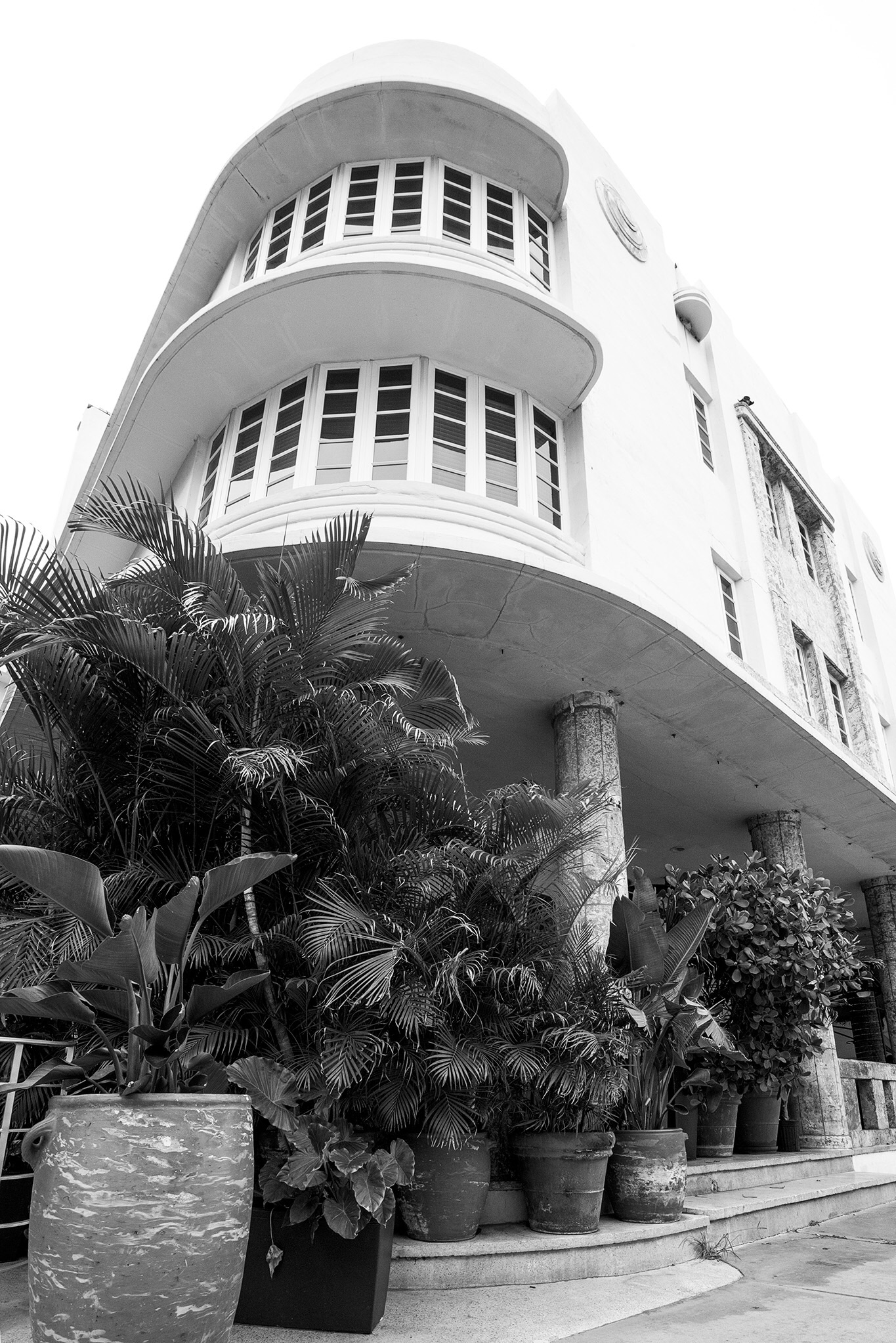 The Art Deco buildings often have a "nautical" look to them, evoking a steam ship, exemplified here by the rounded "bow" of the building and the "porthole" windows.